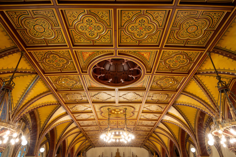 An intricate gold and painted ceiling