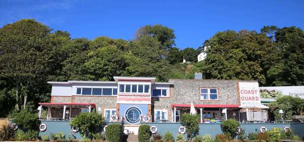 Exterior of the Coastguard with outside seating and benches