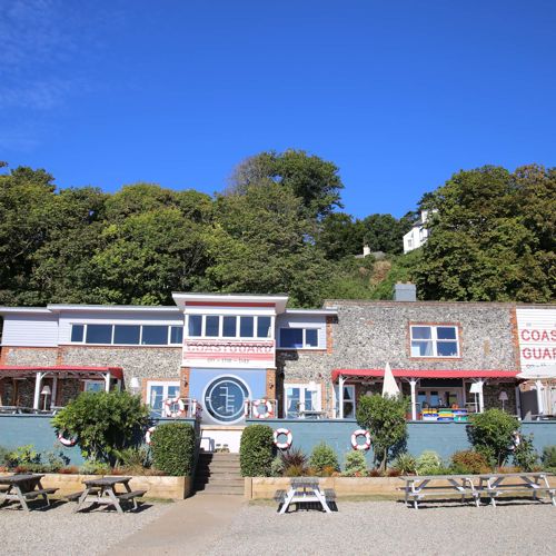 Exterior of the Coastguard with outside seating and benches