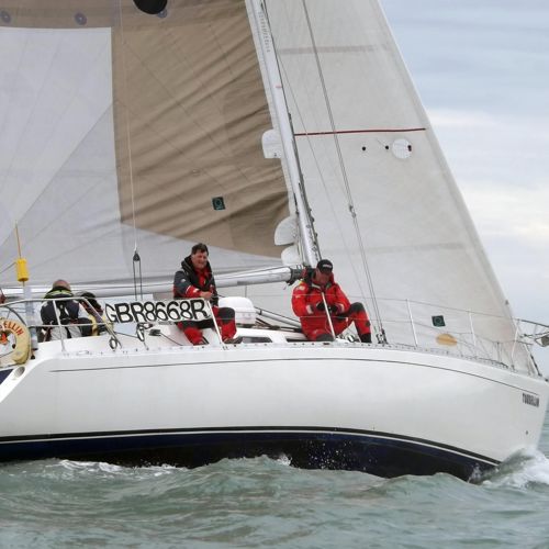 A close up of a yacht and crew out at sea