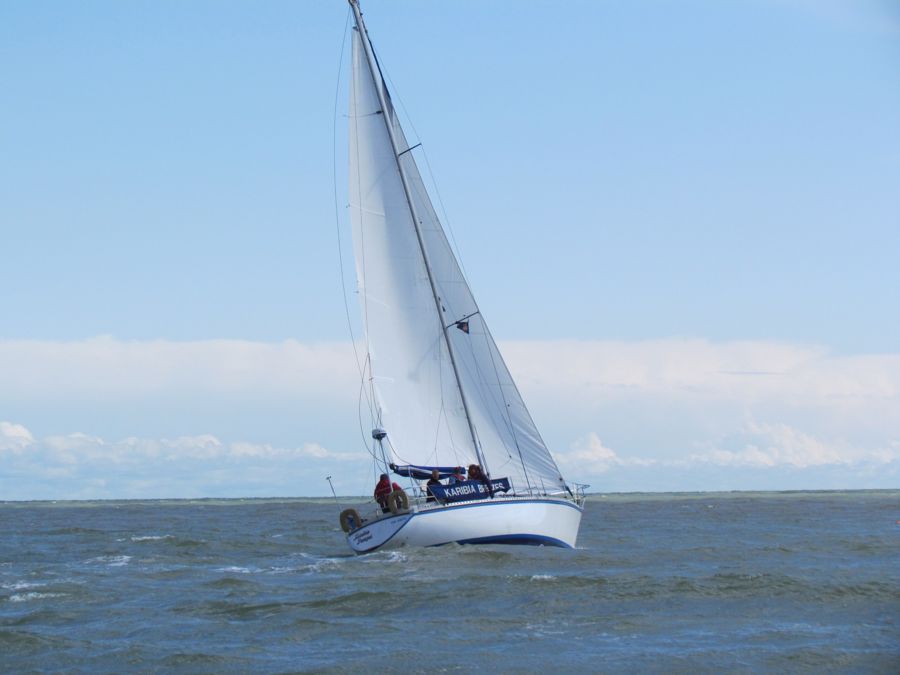 A yacht and crew out at sea