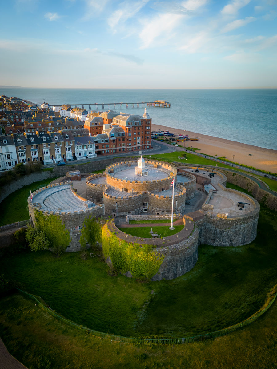 Aerial view of Deal Castle, seafront and pier in the distance.