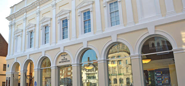 The exterior of Dover Museum - a pillared Victorian facade painted cream and white