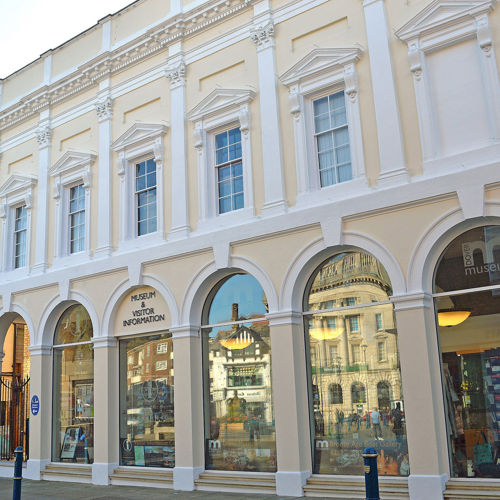 The exterior of Dover Museum - a pillared Victorian facade painted cream and white