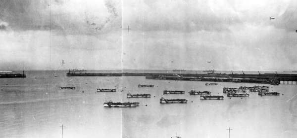 Black and white photo of dummy landing craft in Dover Harbour in 1944.