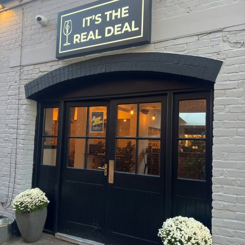 Photo of the exterior of It’s The Real Deal