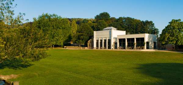 Exterior of Kearsney Café with picnic benches and lawn  