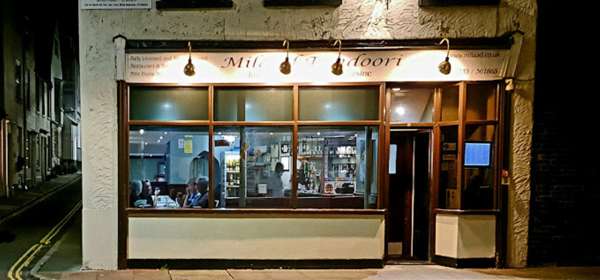 View of the Milaad Tandoori frontage at night