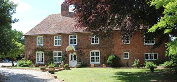 Front of Molland manor House with large Lawn in front.