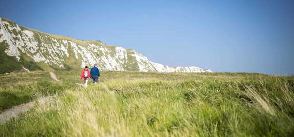 Couple walking along pathway at Samphire Hoe