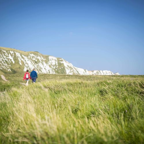 Couple walking along pathway at Samphire Hoe