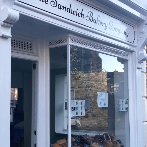 The shop window of The Sandwich Bakery Company displaying a selection of artisan breads