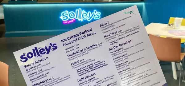 Interior of Solley's Ice Cream Parlour showing the bright counter and menu.