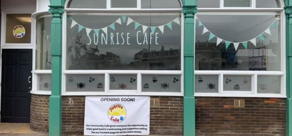 The frontage of the Sunrise Cafe in Dover with a sign saying 'opening soon'.