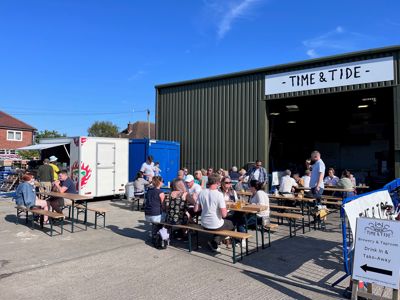 Summer outside drinking area with tables and chairs