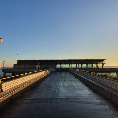 Deal Pier at sunset, looking down the pier towards the sea